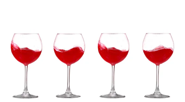 Red wine splashing in a glass, isolated on white — Stock Photo, Image