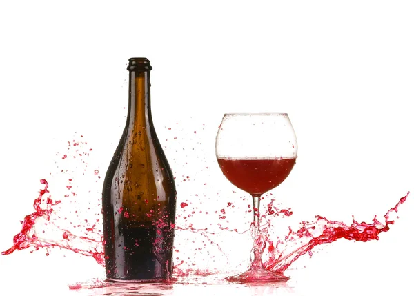 Стекло с красным брызгом вина — стоковое фото