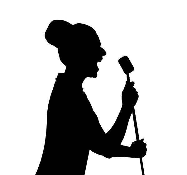 A silhouette of a woman in front of a microphone — Stock Photo, Image