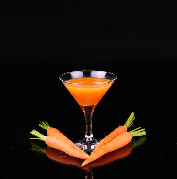 Carrots and juice in a glass — Stock Photo, Image