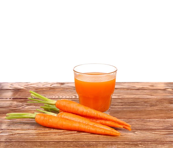 Carrot juice and carrots. Selective focus — Stock Photo, Image