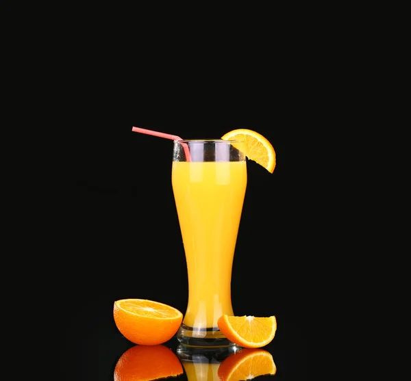 Fresh organic orange juice and vodka in a tall glass  on a black background — Stock Photo, Image