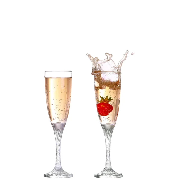 Kolase single strawberry splashing into a glass of champagne — Stok Foto