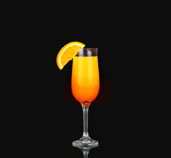 Mimosa cocktail glass  on black. design element Royalty Free Stock Photos