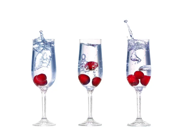 Collage cherry splash in a cocktail glass on white — Stock Photo, Image