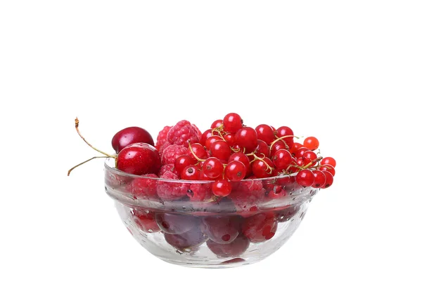 Raspberries and currants cherries in a glass on white — Stock Photo, Image