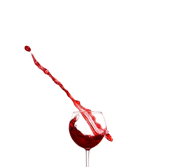Red wine splashing from glass, isolated on white background — Stock Photo, Image
