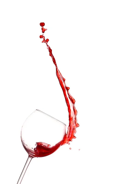 Red wine splashing from glass, isolated on white background — Stock Photo, Image