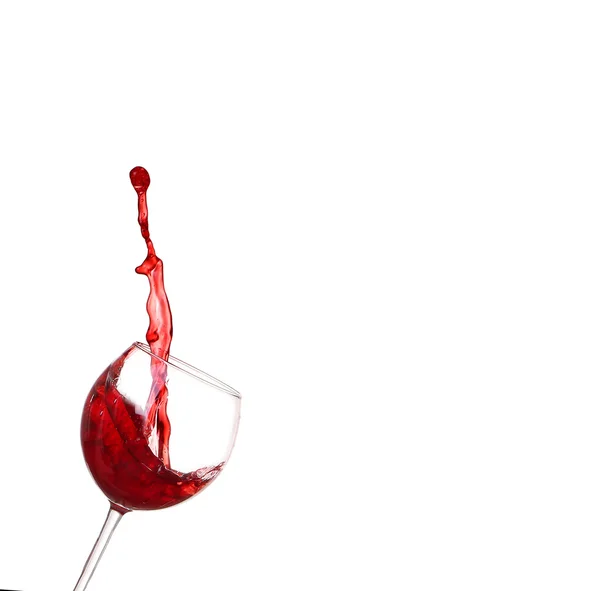 Red wine splashing from glass, isolated on white background — Stock Photo, Image