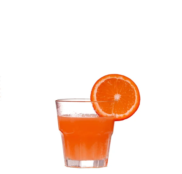 Grapefruit juice in glass and white isolate — Stock Photo, Image