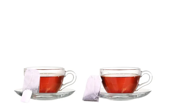 Collage Taza de té con bolsita de té sobre fondo blanco —  Fotos de Stock