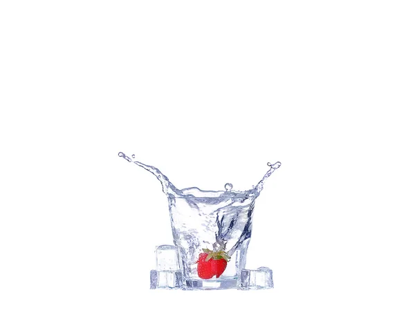 Strawberries, ice cubes into the glass — Stock Photo, Image