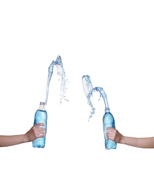 Collage Wasserflasche mit Wasserspritzer in der Hand — Stockfoto