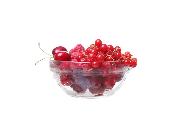 Raspberries and currants cherries in a glass on white — Stock Photo, Image