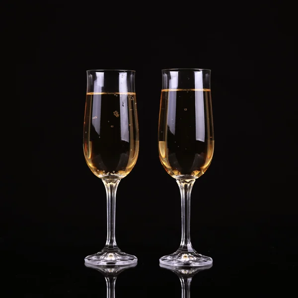 A glass of champagne, on a black background. — Stock Photo, Image