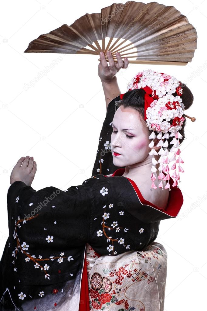 young pretty geisha in kimono with sakura and decoration