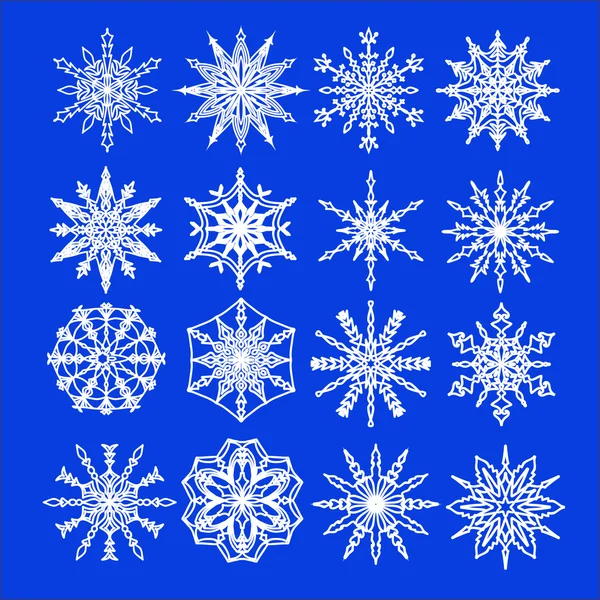 Ensemble de flocons de neige sur bleu — Image vectorielle