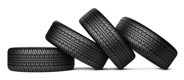 Pile of four black wheel tyres for car — Stock Photo, Image