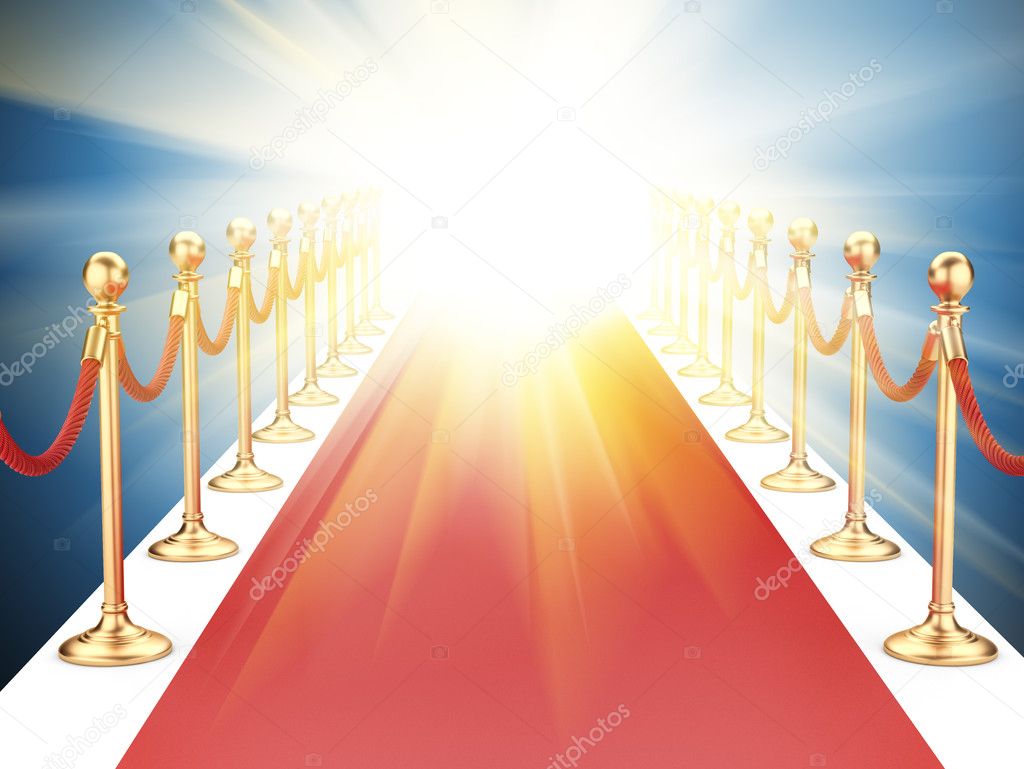 red carpet between two gold stanchions with rope