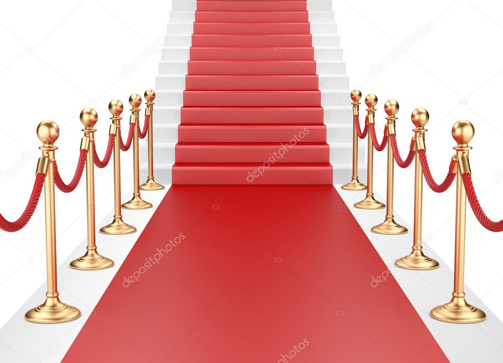 Staircase and red carpet between two gold stanchions with rope