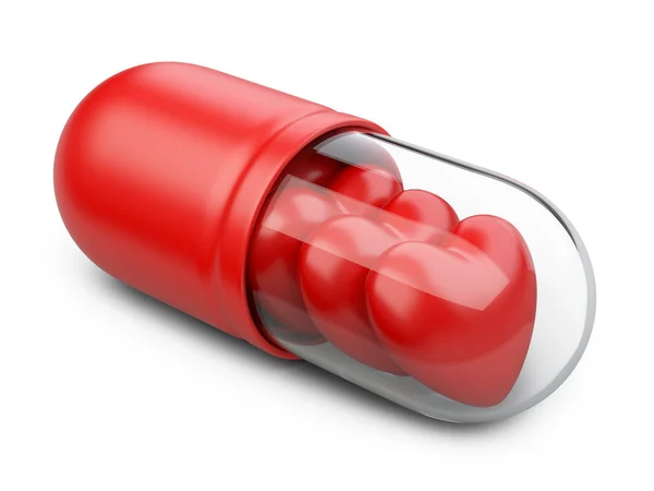 Red hearts in the pill. — Stock Photo, Image