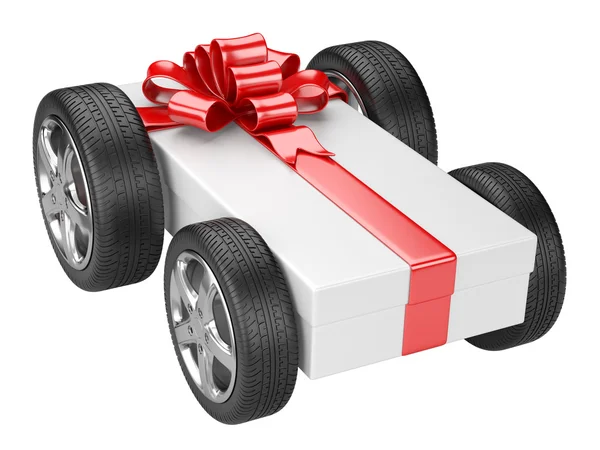 Gift box and a tyre wheels — Stock Photo, Image