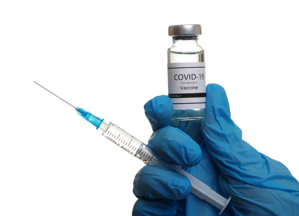 Coronavirus vaccine COVID-19 in glass bottle in  doctor hand isolated on white background. 