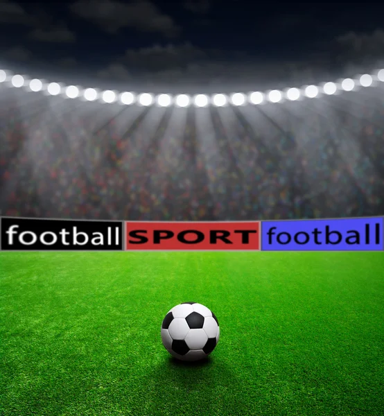 Футбольний м'яч і стадіон — стокове фото