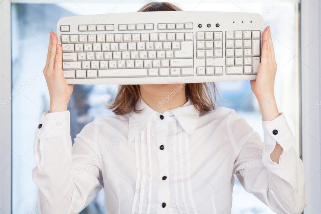 Woman holding keyboard