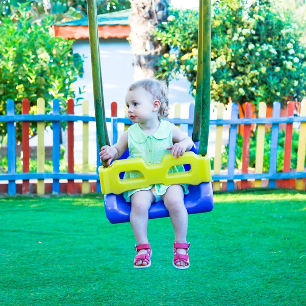 Little girl on the swing — Stock Photo, Image