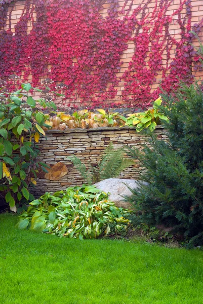 Garden stone with grass — Stock Photo, Image