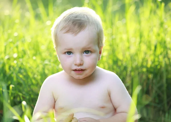 Baby boy in garden. — Stock Photo, Image