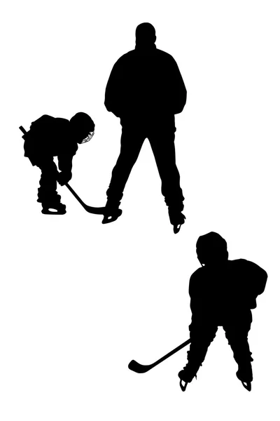 Силуэты хоккеистов — стоковое фото