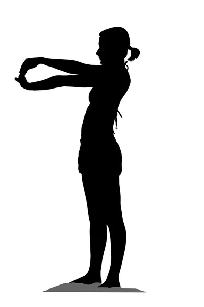 Silhouette of a girl doing exercises — Stock Photo, Image