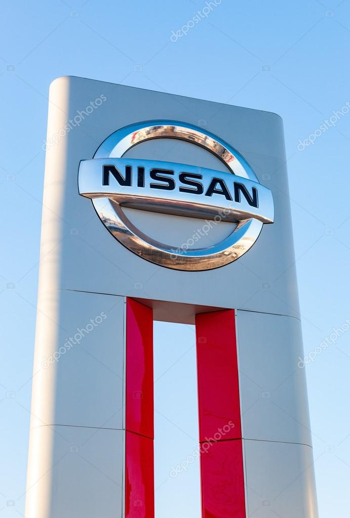 SAMARA, RUSSIA - FEBRUARY 13, 2016: Official dealership sign of Nissan against blue sky. Nissan is a Japanese multinational automaker