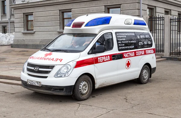 Ambulance car parked up in the street. Text in russian: "The fir — Stock Photo, Image