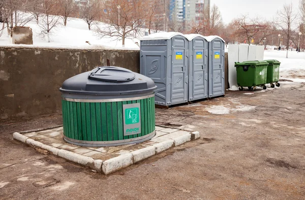 Public toilets and garbage cans on city street — Stock Photo, Image