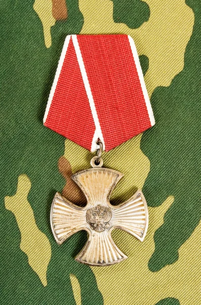 Order of bravery on the camouflage background — Stock Photo, Image