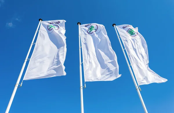 The dealership flags of Skoda over blue sky — Stock Photo, Image