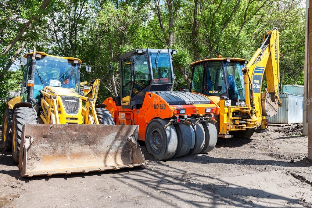 Heavy construction machinery parked near the under construction Stock