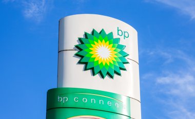BP - British Petroleum petrol station logo against blue sky  clipart