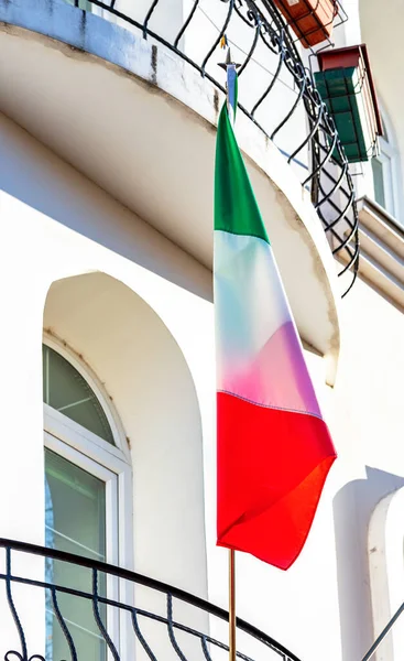 State flag of Italy on the balcony of the house