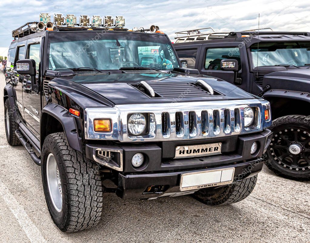 Samara, Russia - May 18, 2019: Black luxury Hummer cars parking at the city street in summer day