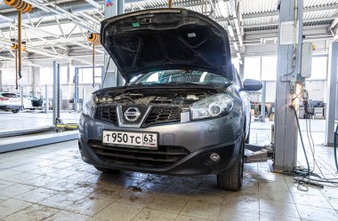 Samara, Russia - May 25, 2021: Cars at the auto repair service station. Auto service of the official dealer Nissan