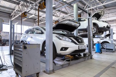 Samara, Russia - May 25, 2021: Cars at the auto repair service station. Auto service of the official dealer Nissan