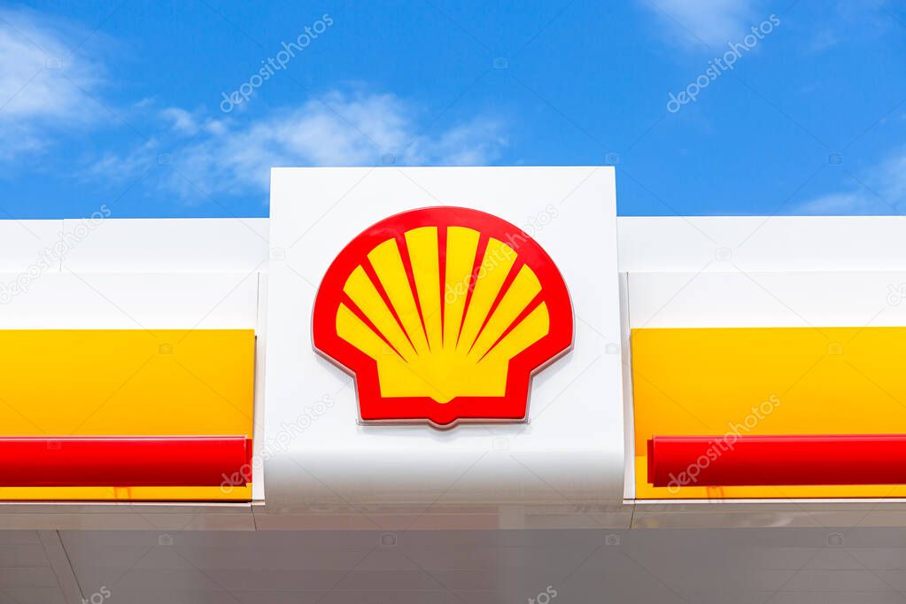Samara, Russia - July 2, 2021: Shell gas station signboard against the blue sky. Shell V-power fuel station