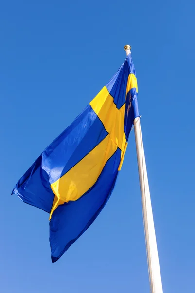 Flag of Sweden waving against blue sky — Stock Photo, Image