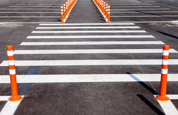 White traffic markings with a pedestrian crossing on a gray asph — Stock Photo, Image