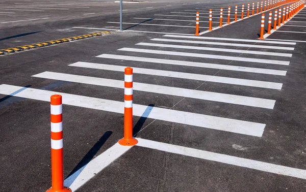 White traffic markings with a pedestrian crossing on a gray asph — Stock Photo, Image