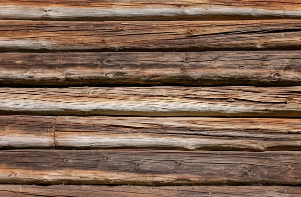 Houten logboeken muur van oude vakantiehuis achtergrond — Stockfoto